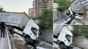 İstanbul Esenler'de kumaş yüklü TIR dere yatağına düştü